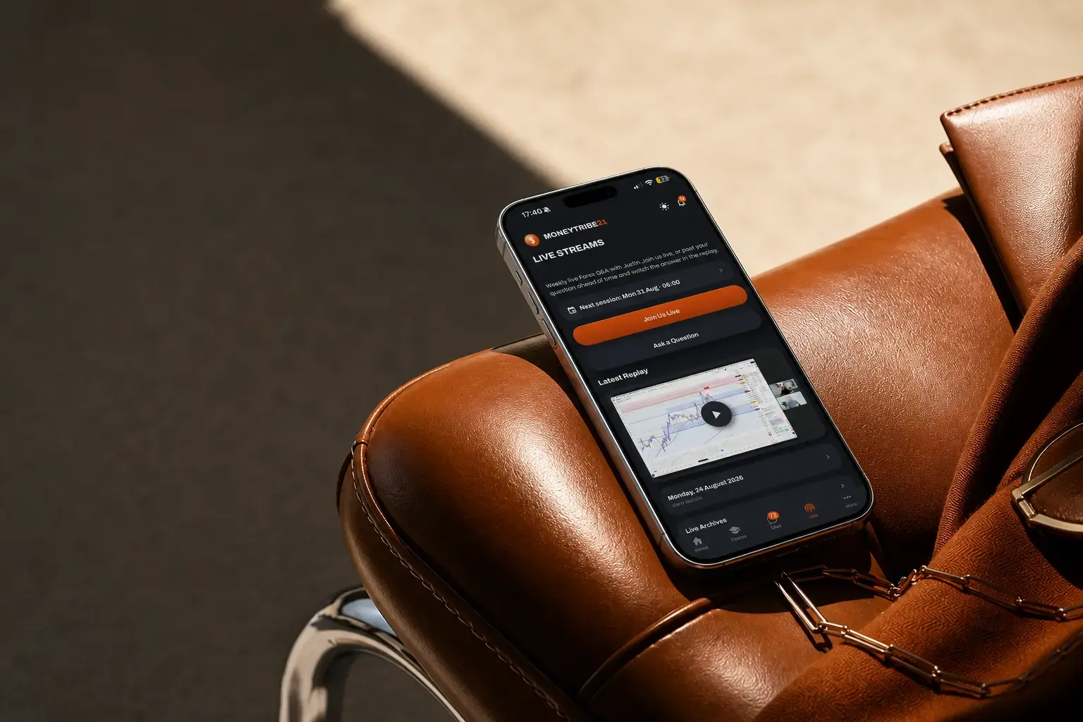The MoneyTribe21 live streams screen on a phone